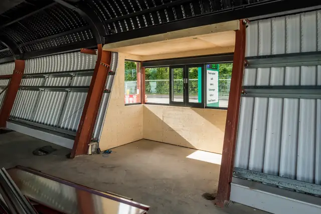 Interior of a steel framed unit during construction with the window opening formed and ready for glazing