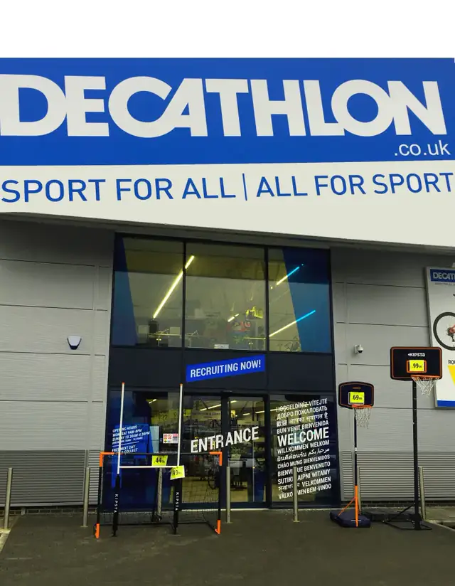 Decathlon store entrance with automatic sliding doors under the store sign