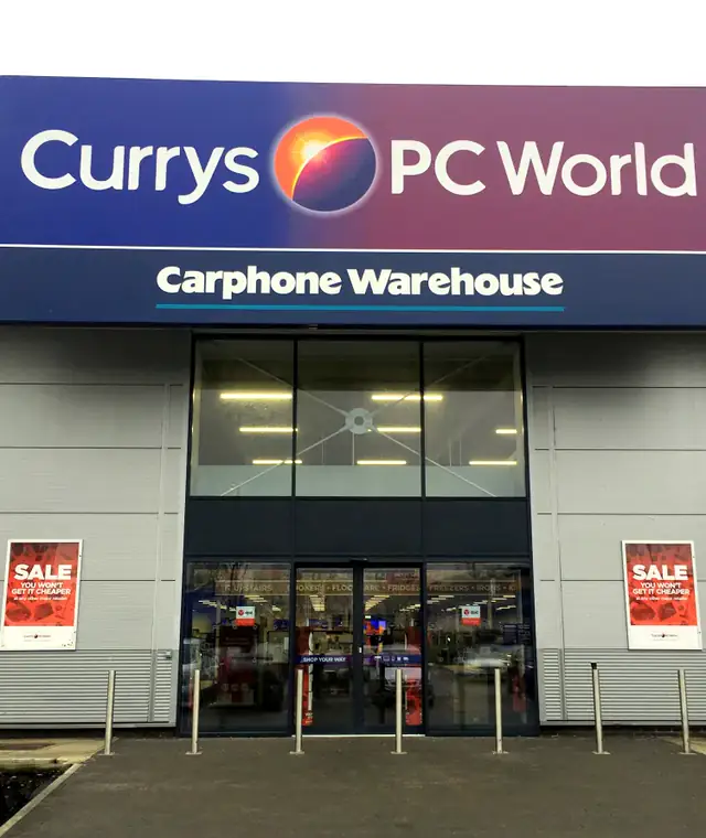 Currys PC World store entrance with automatic sliding doors and a glazed lobby