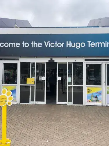 Automatic sliding entrance at the Victor Hugo passenger terminal under the welcome sign